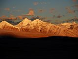 18 Chalung Ri Shines At Sunrise From Shishapangma North Base Camp The mountains around Chalung Ri (6767m) simply glow at sunrise from Shishapangma North Chinese Base Camp. Chalung Ri is the tall triangular peak in the left middle of the photo.